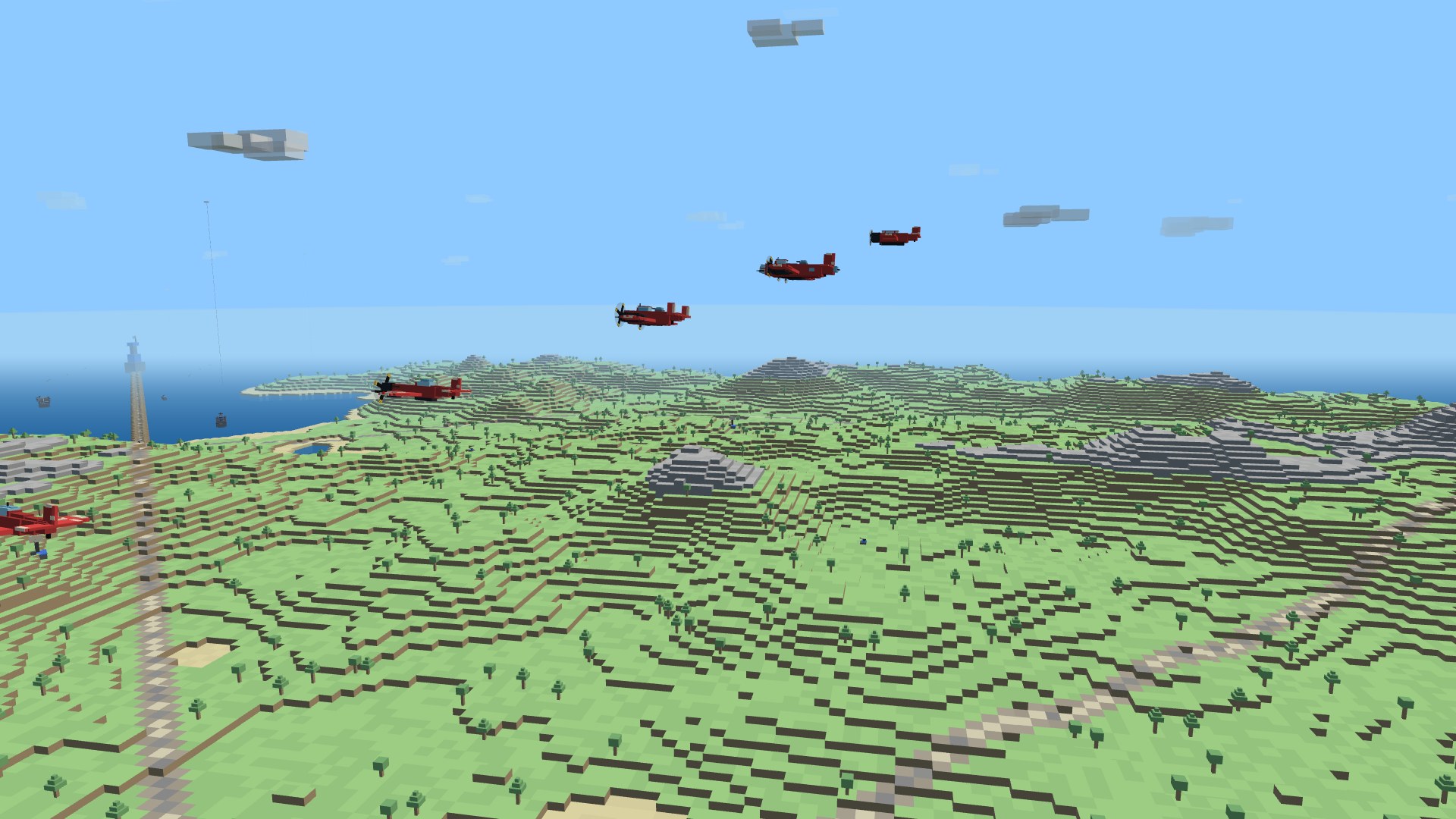 All five warbird types flying in a shallow echelon over the island